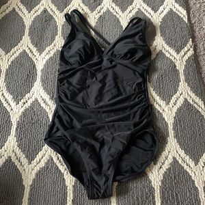 One piece suit with cross cross back straps